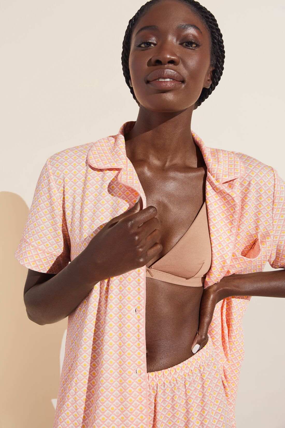 Fatou is 5'10" and wears a Small.